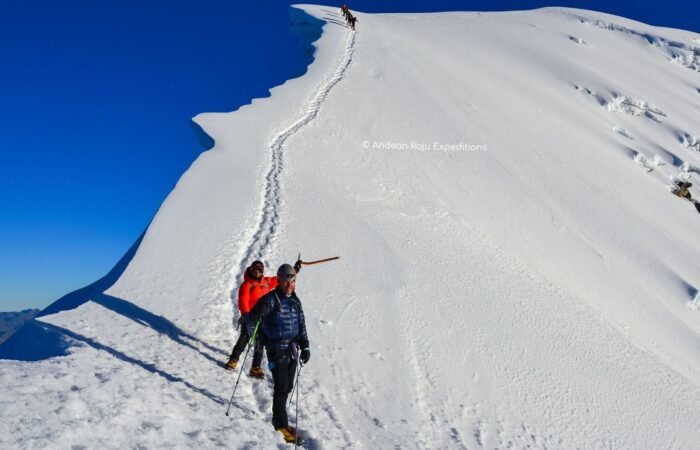 Descending from the Vallunaraju summit with our client Juan from Lima.