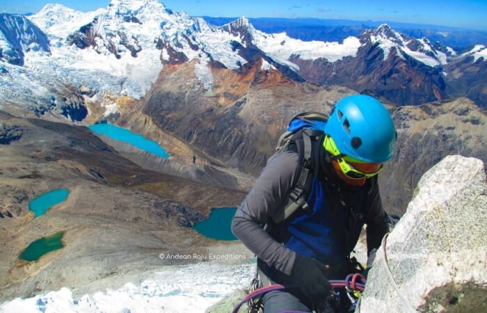Eloy putting a belay to rappel