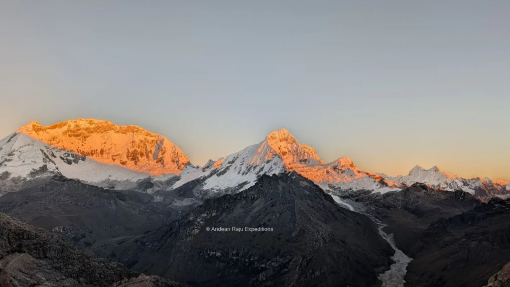 Sunrise alpenglow on Huascarán and Chopicalqui seen from the Nevado Mateo route above the Ulta valley, Cordillera Blanca