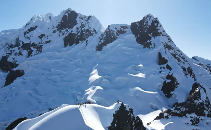 Climbers on the glacier of Nevado Mateo with Huascarán in the background, Cordillera Blanca, Peru